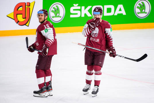 Martins Karsums and Rihards Marenis of Latvia look dejected