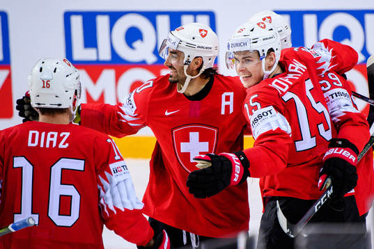 Andres Ambuh and Gregory Hofmann of Switzerland celebrate