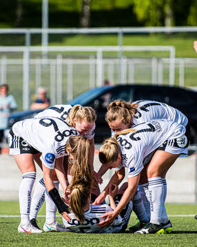 Cesilie Andreassen of Rosenborg (on the ground) celebrates