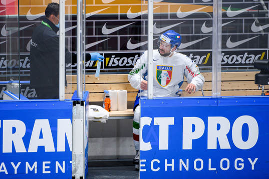 Stefano Giliati of Italy receives a face mask in the