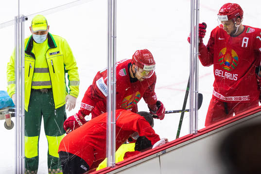 A player of Belarus receives medical treatment