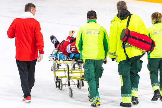 Yevgeni Lisovets of Belarus leaves the ice