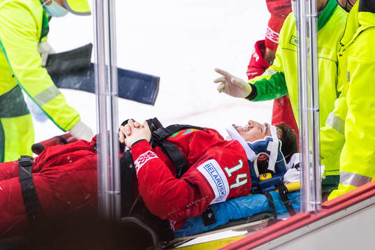 Yevgeni Lisovets of Belarus receives medical attention