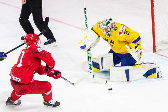 Vladislav Kodola of Belarus and goalkeeper Adam Reideborn