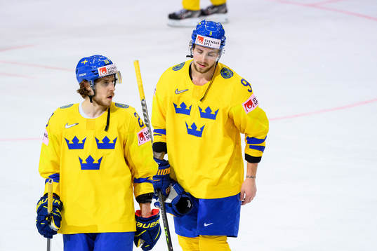 Mario Kempe and Adrian Kempe of Sweden look dejected