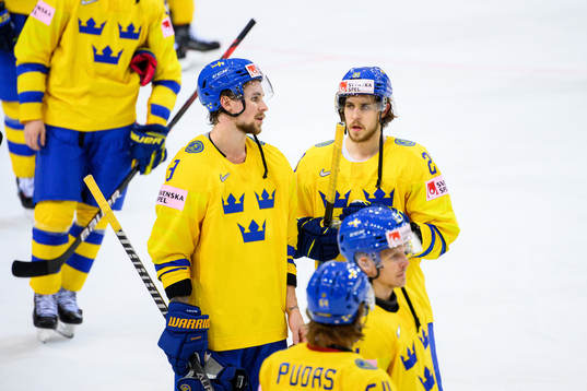 Mario Kempe and Adrian Kempe of Sweden look dejected