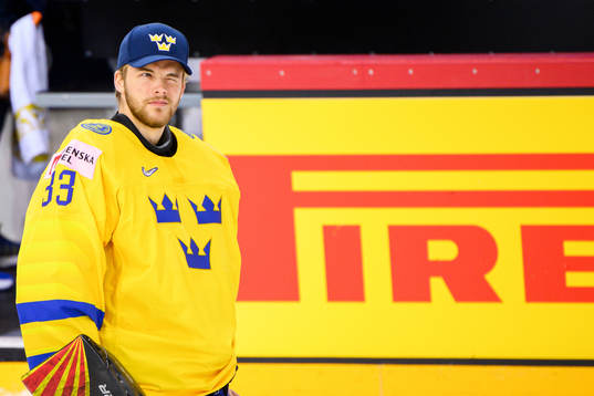 Goaltender Samuel Ersson of Sweden look dejected