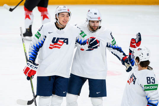 Jason Robertson and Christian Wolanin of USA celebrate the