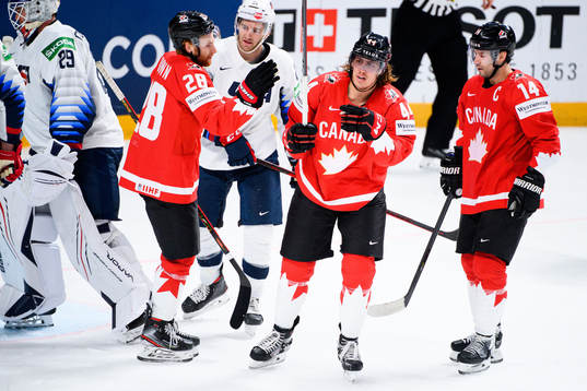 Maxime Comtois of Canada celebrates the 1-4 goal