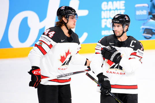 Maxime Comtois and Adam Henrique of Canada look dejected