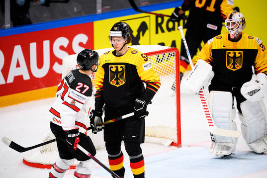 Moritz Seider of Germany against Michael Bunting of Canada