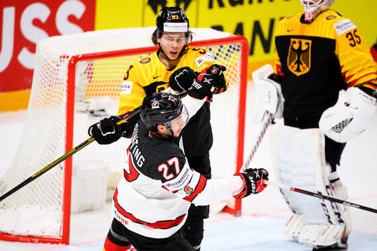 Moritz Seider of Germany against Michael Bunting of Canada