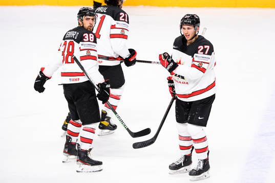 Mario Ferraro and Michael Bunting of Canada react