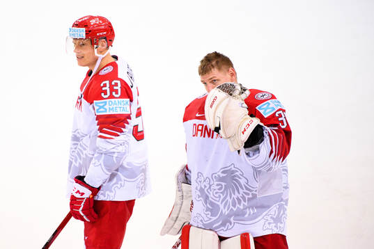 Julian Jakobsen and goalkeeper Sebastian Dahm of Denmark