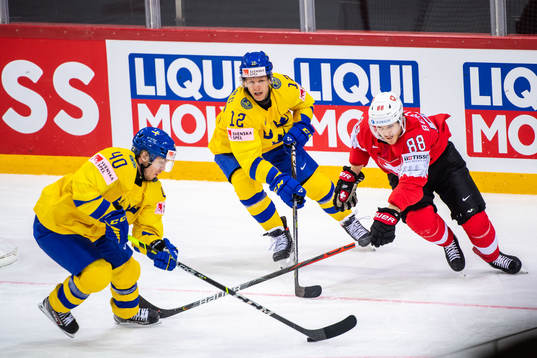Andreas Wingerli and Max Friberg of Sweden and Christoph