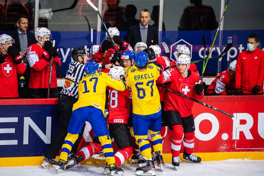 Pär Lindholm of Sweden and Timo Meier of Switzerland in a