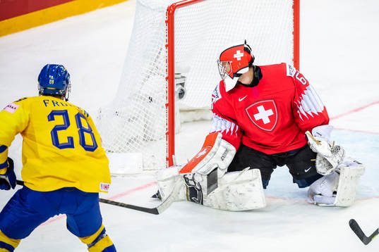 Jesper Frödén of Sweden scores 0-4 behind goalkeeper