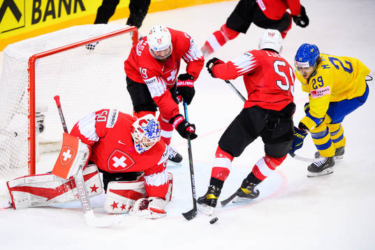 Adrian Kempe of Sweden against goalkeeper Melvin Nyffeler ,