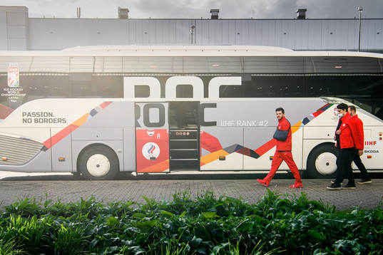 Members of Team Russia outside the ROC bus