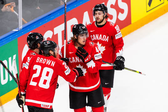 Connor Brown and Andrew Mangipane celebrate with Adam