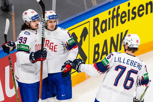 Thomas Valkvæ Olsen of Norway celebrates with Michael Haga