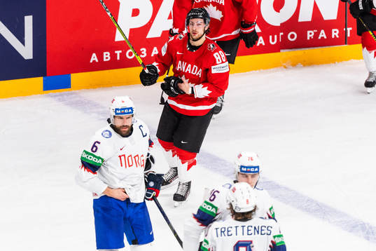 Andrew Mangipane of Canada looks dejected