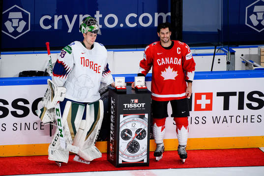 Goalkeeper Henrik Haukeland of Norway and Adam Henrique of