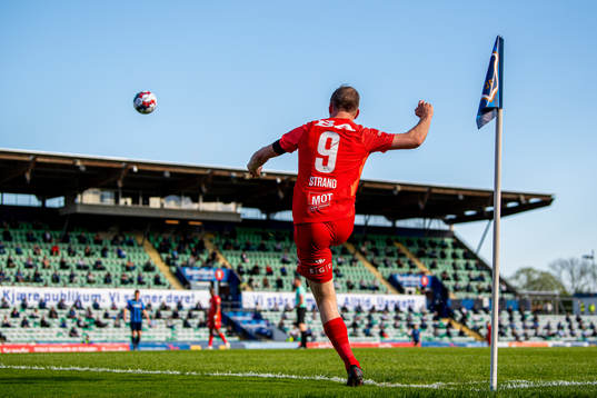 Petter Strand of Brann takes a corner kick