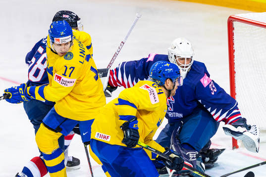 Pär Lindholm of Sweden and goalkeeper Ben Bowns of Great