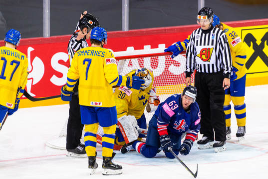 Henrik Tömmernes and goalkeeper Viktor Fasth of Sweden
