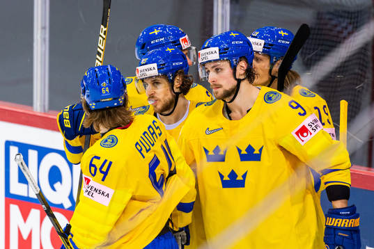 Mario Kempe of Sweden celebrates with team mates