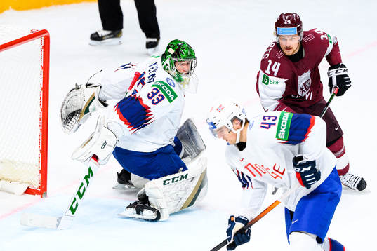 Goalkeeper Henrik Haukeland of Norway and Rihards Bukarts