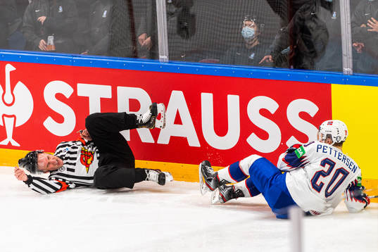 Emilio Pettersen of Norway collides with a referee