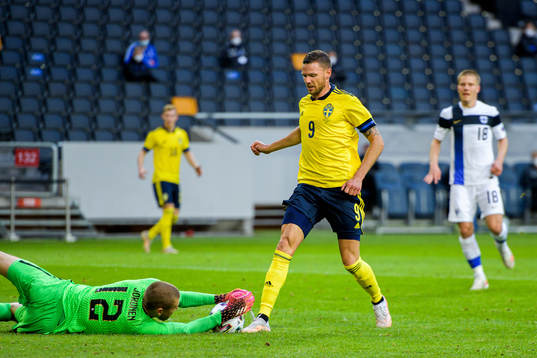 Marcus Berg of Sweden against goalkeeper Jesse Joronen of