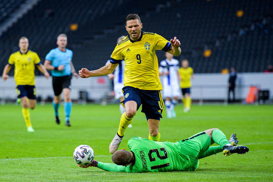 Marcus Berg of Sweden and goalkeeper Jesse Joronen of