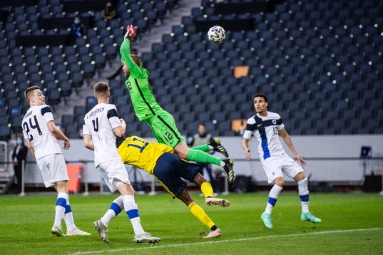 Alexander Isak of Sweden and goalkeeper Jesse Joronen of