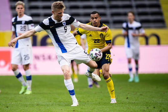Juhani Ojala of Finland and Robin Quaison of Sweden