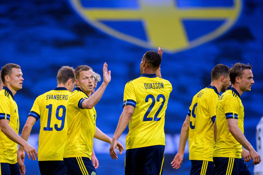 Sebastian Larsson and Robin Quaison of Sweden celebrate the