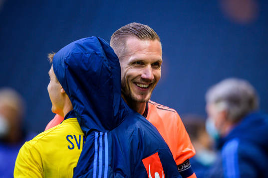 Mattias Svanberg and goalkeeper Robin Olsen of Sweden