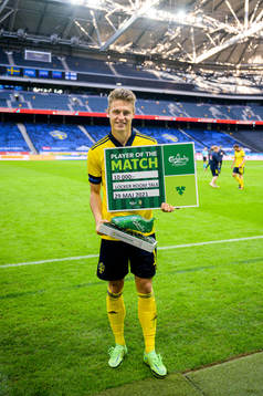 Mattias Svanberg of Sweden with the award for Player of the