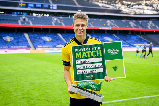 Mattias Svanberg of Sweden with the award for Player of the