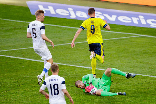 Marcus Berg of Sweden and goalkeeper Jesse Joronen of