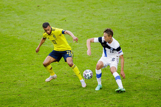 Robin Quaison of Sweden and Lassi Lappalainen of Finland