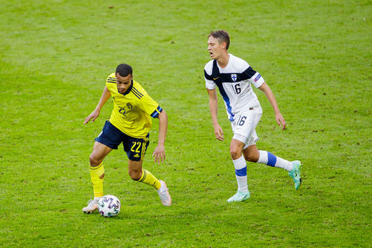 Robin Quaison of Sweden and Lassi Lappalainen of Finland
