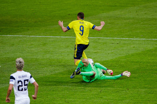 Marcus Berg of Sweden and goalkeeper Jesse Joronen of