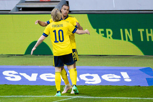 Robin Quaison of Sweden celebrates with Emil Forsberg