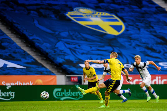 Sebastian Larsson of Sweden scores the 2-0 goal