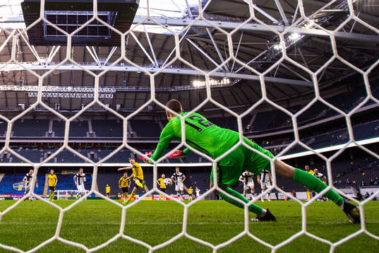 Sebastian Larsson of Sweden scores the 2-0 goal behind