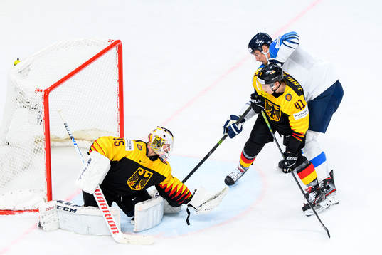 Marko Anttila of Finland against goalkeeper Mathias