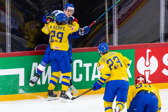 Mario Kempe of Sweden tackles Pavol Skalicky of Slovakia